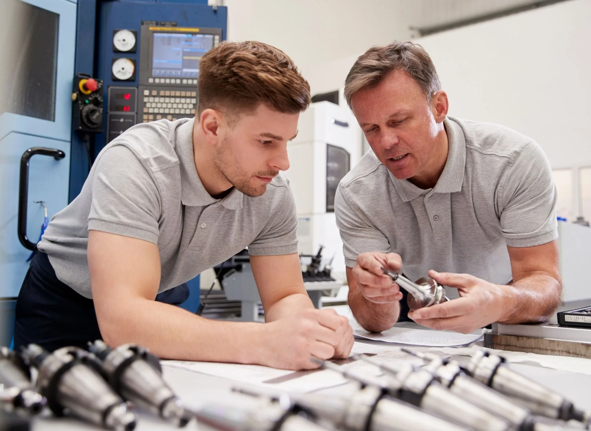 Two males working on a work bench