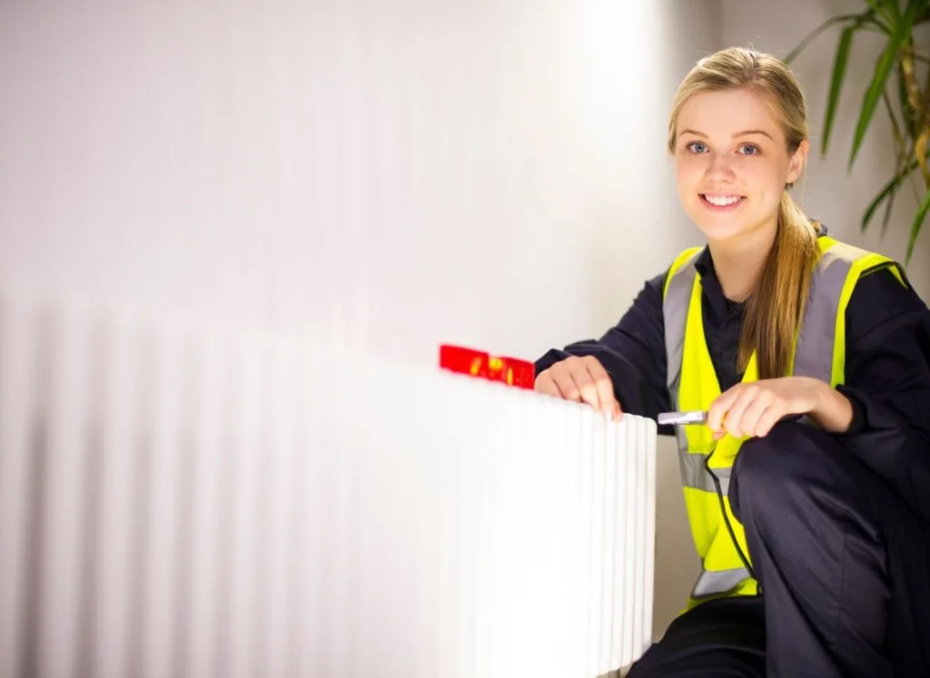Apprentice in PPE and work clothing on site