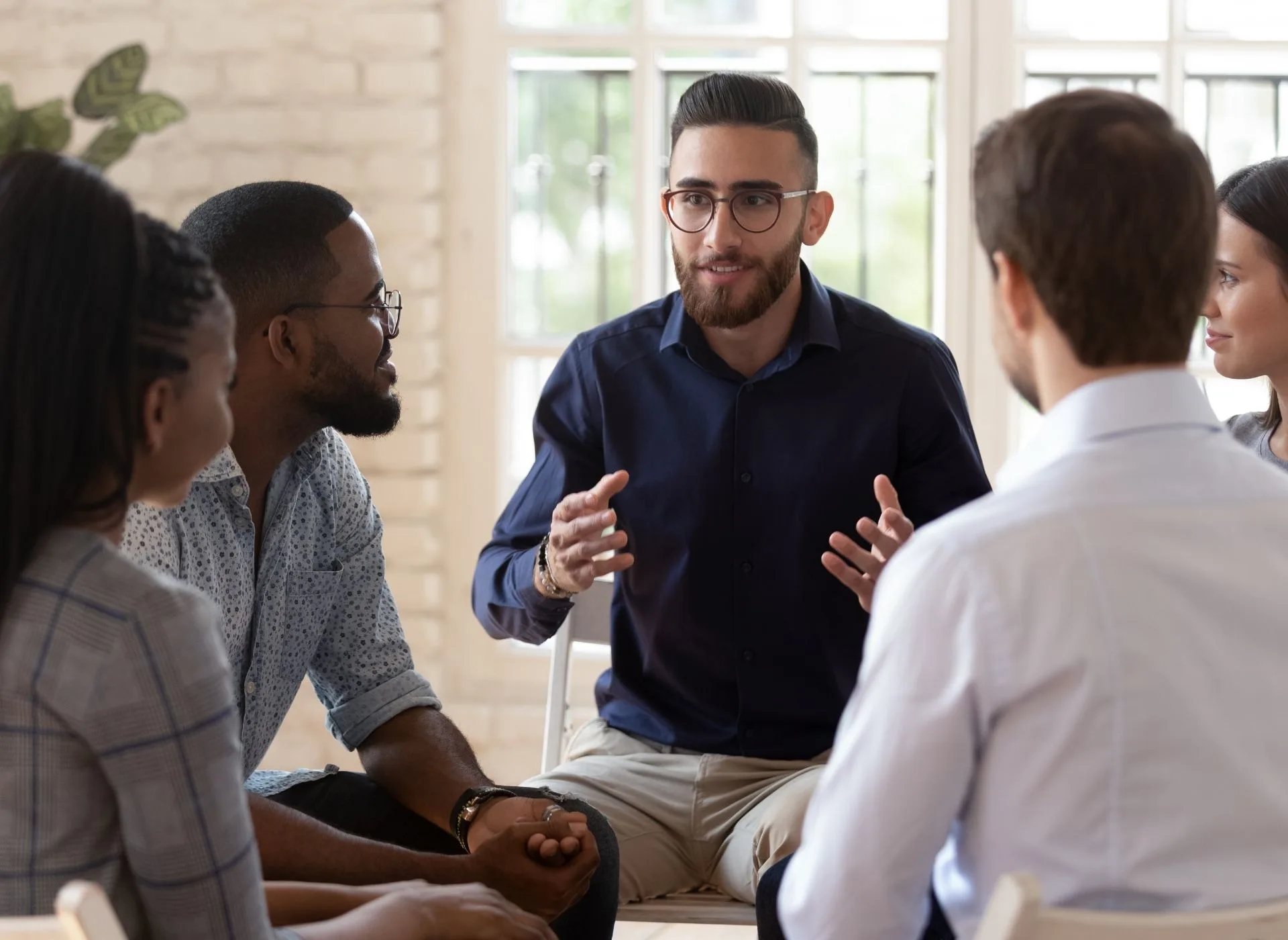 A group of business people talking in office