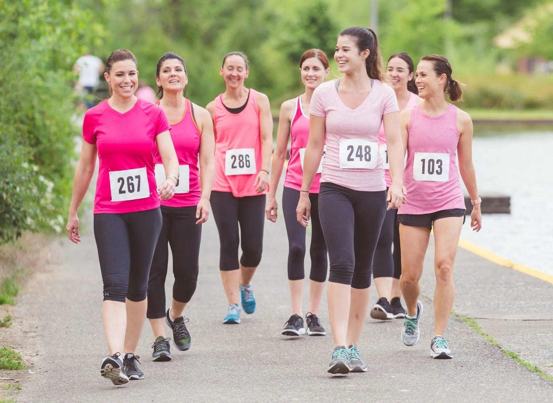 A group of runners in pink t-shirts 