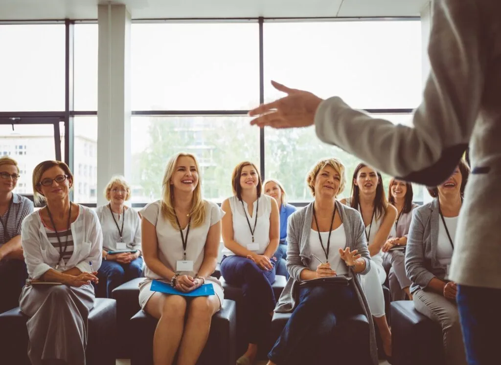 A group of people in conference