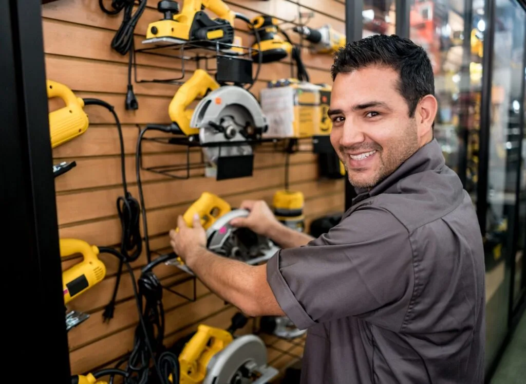 A man selecting powertools in DIY store